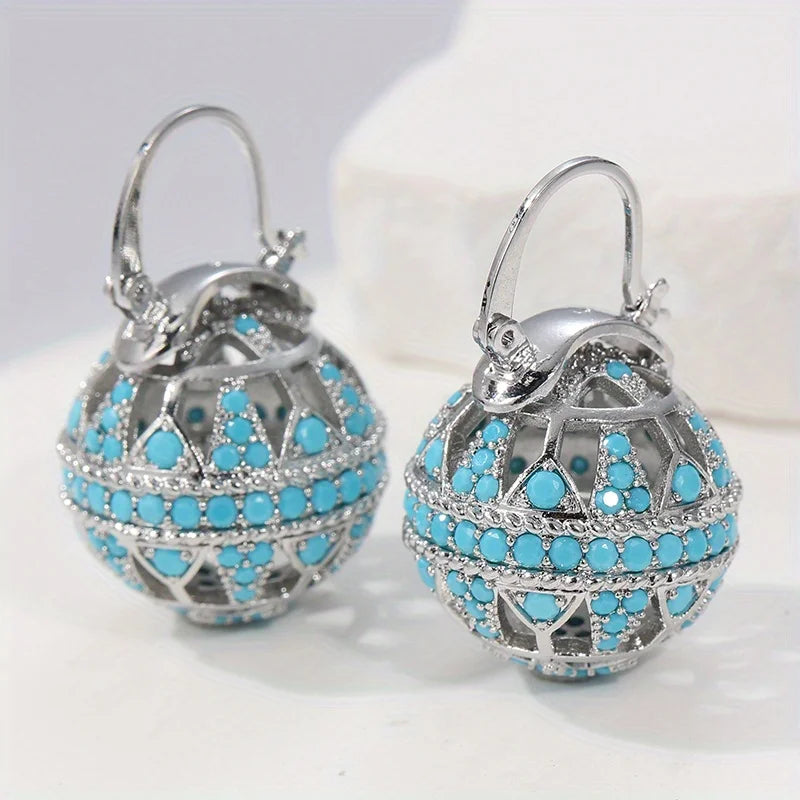 Vergulde turquoise mandala-oorbellen